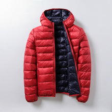 Leichte und thermische Pufferjacke Unisex - Nordika – Orange mit Schwarz
