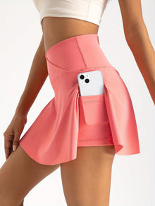 ActiveCharm™ – Eleganter Damen Sportrock mit integrierten Shorts – Orange