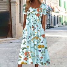 Eloise – Maxikleid im Bohemian-Stil mit Blumenmuster und Taschen | Kurzärmliges Maxikleid mit Blumenmuster im Boho-Chic-Stil für Damen – Blau
