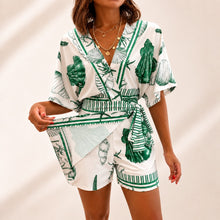 Azzurine™ Skort-Jumpsuit Mit Wickeloptik, Seitlicher Bindung Und Exklusivem Mediterranem Print – Grün