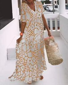 Maxikleid mit Blumenmuster | V-Ausschnitt | Weit schwingender Schnitt – Orange