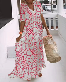 Maxikleid mit Blumenmuster | V-Ausschnitt | Weit schwingender Schnitt – Rosa