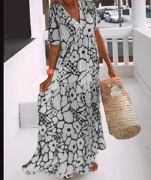 Maxikleid mit Blumenmuster | V-Ausschnitt | Weit schwingender Schnitt – Schwarz